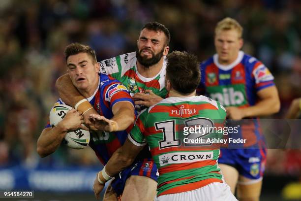 Connor Watson of the Knights is tackled during the round nine NRL match between the Newcastle Knights and the South Sydney Rabbitohs at McDonald...