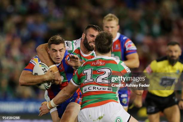 Connor Watson of the Knights is tackled during the round nine NRL match between the Newcastle Knights and the South Sydney Rabbitohs at McDonald...