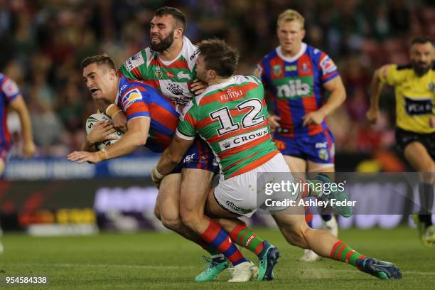 Connor Watson of the Knights is tackled during the round nine NRL match between the Newcastle Knights and the South Sydney Rabbitohs at McDonald...