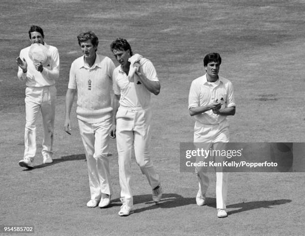 England's Derek Pringle is applauded by teammate Derek Randall after taking five West Indies wickets during the 1st Test match between England and...