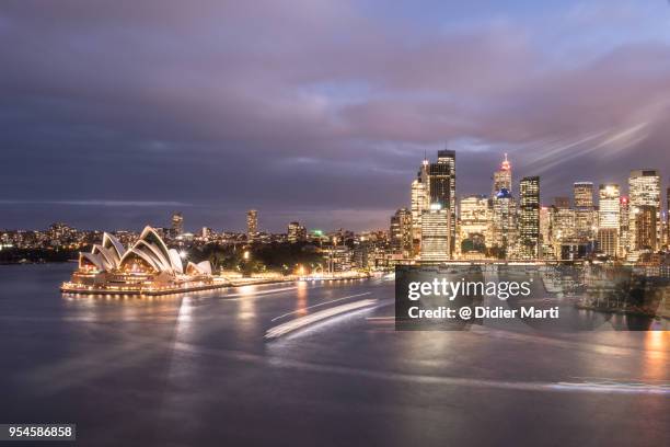 stunning sunset over sydney business district skyline in australia. - the rocks sydney stock-fotos und bilder