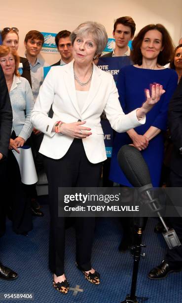 Britain's Prime Minister Theresa May speaks during a visit to Finchley Conservatives in Barnet, north London after the Conservative party retained...