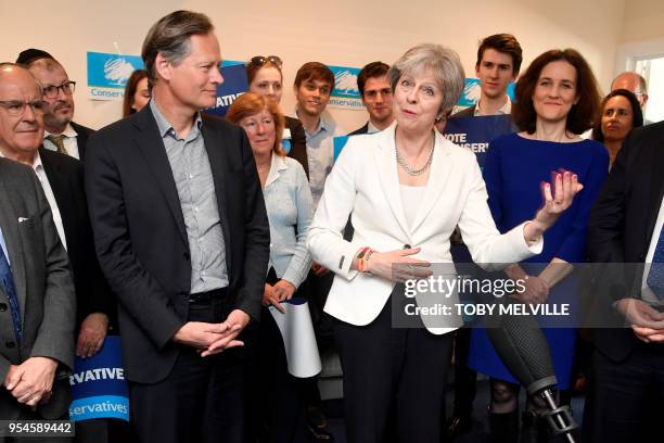 Britain's Prime Minister Theresa May speaks during a visit to Finchley Conservatives in Barnet, north London after the Conservative party retained...