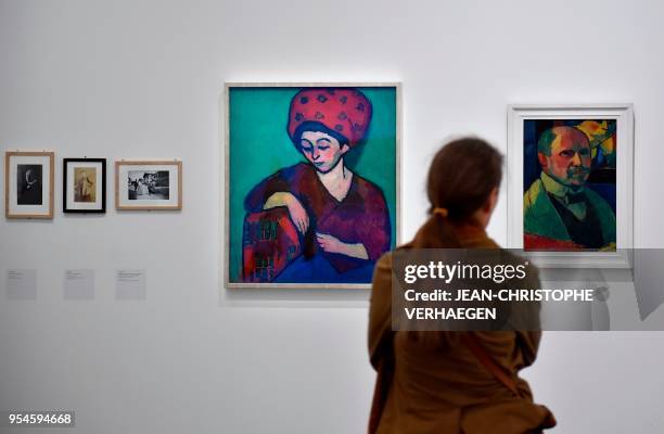 Visitor looks at pieces of art by the couple Alexej Jawlensky and Marianne von Werefkin during the exhibition "Couples modernes" on May 4, 2018 at...