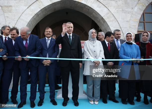 Turkish President Recep Tayyip Erdogan greets the crowd as he attends the opening ceremony of Spice Bazaar after restoration works in Fatih district...