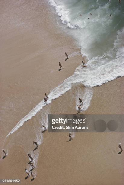 View from above holidaymakers at Caleta Beach, Acapulco, Mexico, 1968.