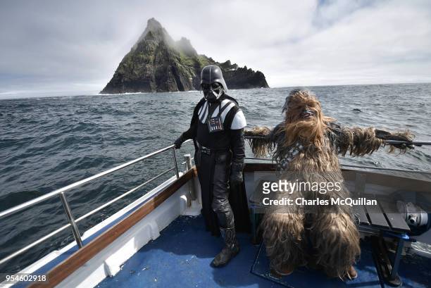 Fans dressed as Darth Vader and Chewbacca take a boat trip to the Skelligs on May 4, 2018 in Portmagee, Ireland. The first ever Star Wars festival is...
