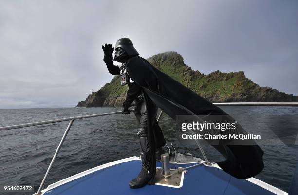 Star Wars fan dressed as the character Darth Vader takes a boat trip to the Skelligs on International Star Wars day May 4, 2018 in Portmagee,...