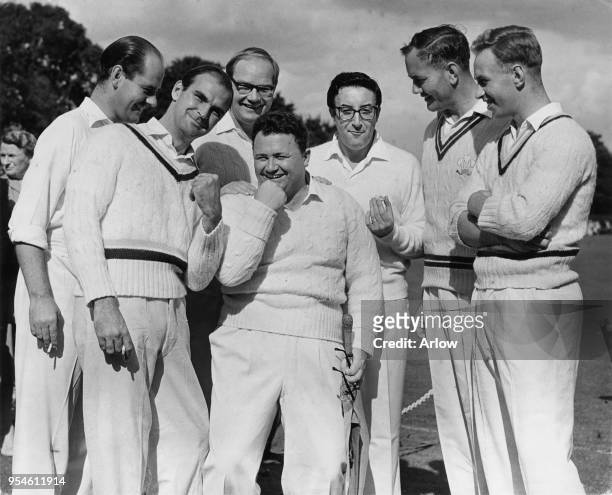 Welsh comedian and singer Harry Secombe captains a celebrity team in a charity cricket match against Sutton at Sutton, UK, September 1958. Actor...