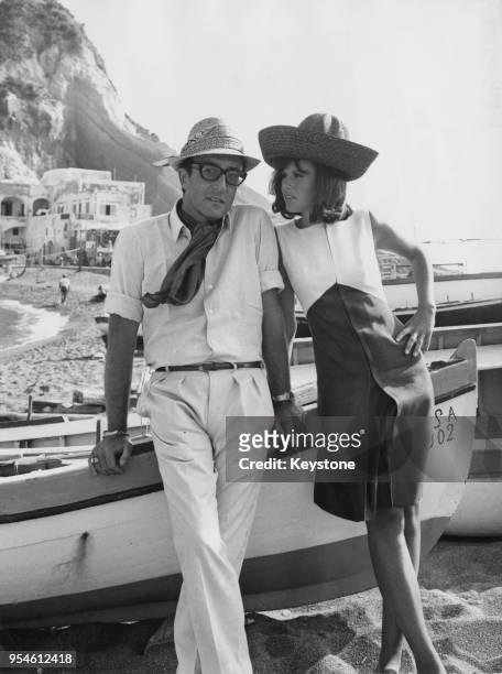 English actor Peter Sellers with his wife, actress Britt Ekland in the village of Sant-Angelo, Ischia, Italy, during the filming of 'Caccia alla...