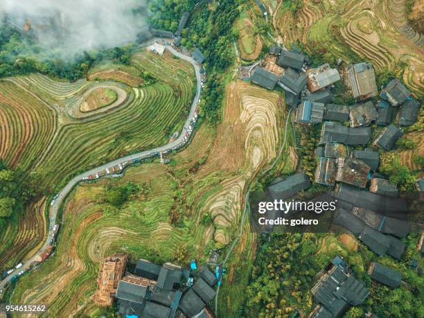 drone  view on village in the longsheng rice terrace fields - longsheng stock pictures, royalty-free photos & images