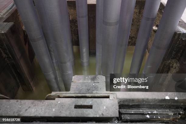 Rows of cylindrical extrusion billets of aluminium are seen during the production process inside the Trimet Aluminium SE plant in Essen, Germany, on...