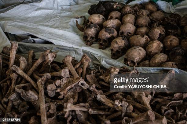 Picture taken on April 30 shows collected victims' bones and skulls from a newly discovered pit which was used as mass grave during 1994 Rwandan...