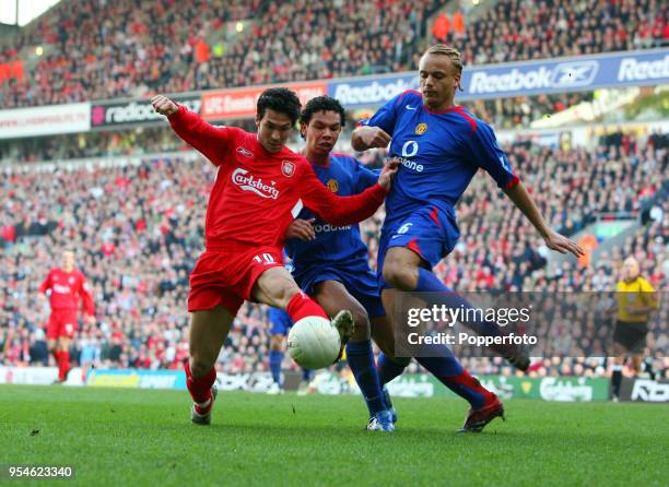 Luis Garcia of Liverpool battles with Wes Brown and Kieran Richardson of Manchester United during the FA Cup 5th round match between Liverpool and...