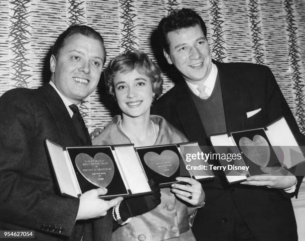 From left to right, actors Richard Attenborough , Sylvia Syms and Max Bygraves with their awards at the Variety Club Annual Show Business Awards...