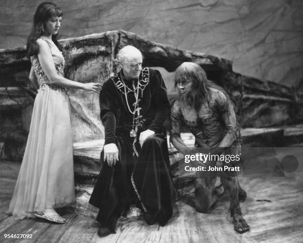 Scottish actor Alastair Sim as Prospero, with Eileen Atkins as Miranda and George Selway as Caliban, during a rehearsal for Shakespeare's 'The...