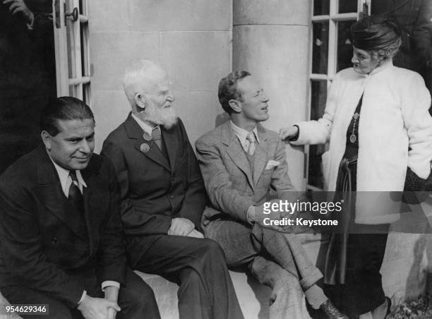 From left to right, producer Gabriel Pascal , Irish playwright George Bernard Shaw , English actor Leslie Howard and Lady Oxford during a luncheon at...