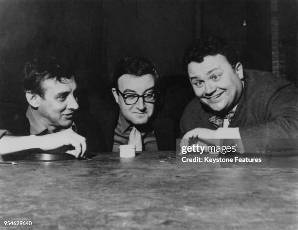 From left to right, actors and comedians Spike Milligan, Peter Sellers and Harry Secombe of British radio comedy 'The Goon Show' prepare for a...