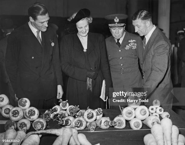 From left to right, Aidan Merivale Crawley , the Under-Secretary of State for Air, Lady Slessor, and Air Chief Marshal Sir Hugh Pughe Lloyd , Air...