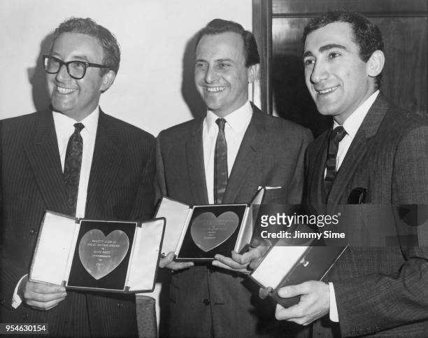 From left to right, actor Peter Sellers, David Jacobs and composer Lionel Bart holding awards belonging to Alfie Bass and Shirley Anne Field at the...
