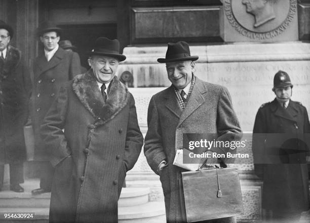 Konrad Adenauer , the German Chancellor, and Robert Schuman , the French Foreign Minister, leave the Foreign Office in London after attending the...