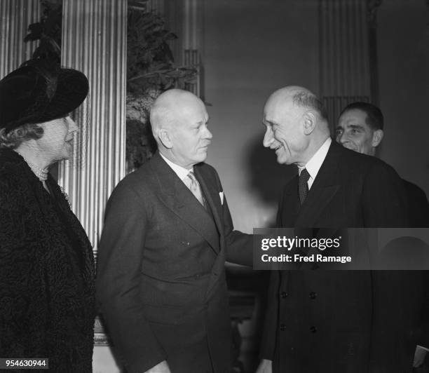 Robert Schuman , the French Foreign Minister, talks to Vere Ponsonby, the 9th Earl of Bessborough , President of the Franco-British Association, at a...