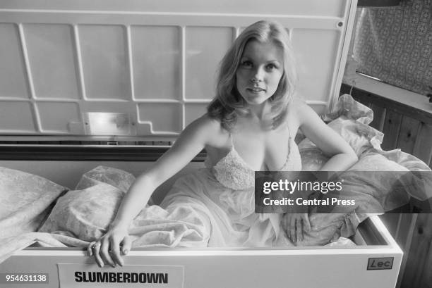 Swedish actress Leena Skoog demonstrates the efficacy of a Slumberdown quilt by sleeping for six hours in a chest freezer, 15th March 1972.