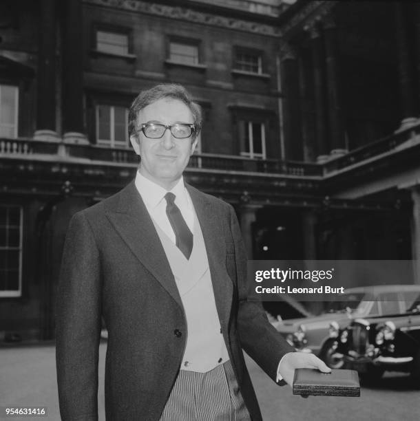 English actor Peter Sellers leaves Buckingham Palace with his CBE after his investiture, London, 7th February 1967.