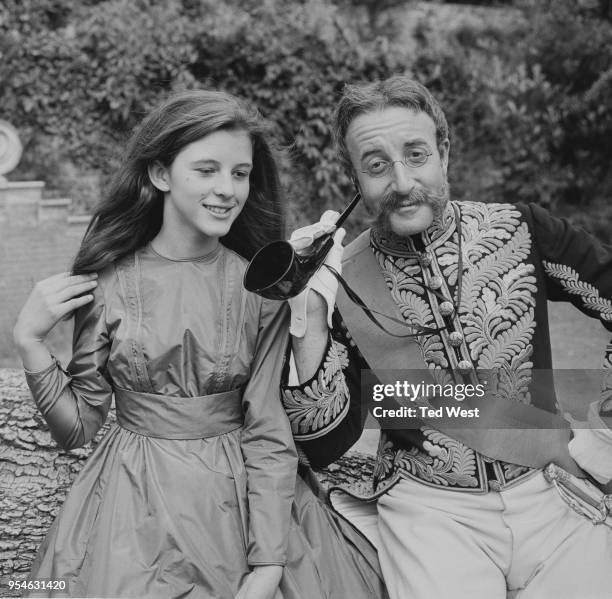Actors Anne-Marie Mallik and Peter Sellers , during the filming of a BBC production of Lewis Carroll's 'Alice In Wonderland' in Albury Park near...