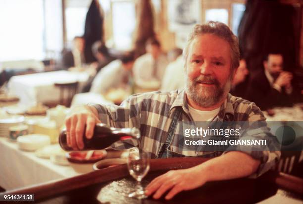 Man at a counter of a 'bouchon', typical restaurant of Lyon, March 1998, France.