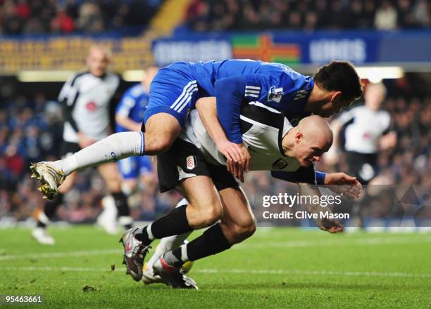 Paul Konchesky of Fulham battles with Michael Ballack of Chelsea during the Barclays Premier League match between Chelsea and Fulham at Stamford...