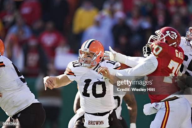 Quarterback Brady Quinn of the Cleveland Browns throws a pass under pressure from Dion Gales of the Kansas City Chiefs at Arrowhead Stadium on...