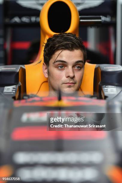 Martin Garrix samples the car during the Red Bull Racing Vietnam show run on May 4, 2018 in Ho Chi Minh City, Vietnam.