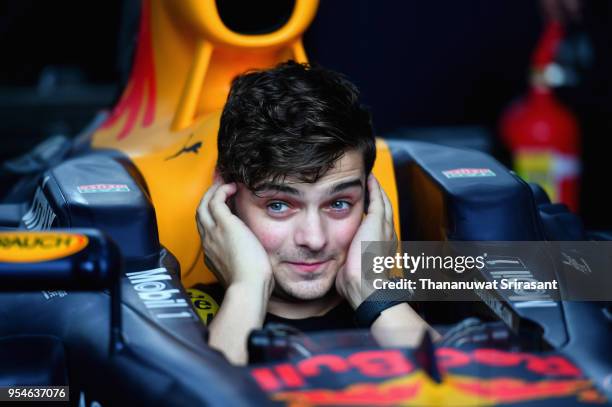 Martin Garrix samples the car during the Red Bull Racing Vietnam show run on May 4, 2018 in Ho Chi Minh City, Vietnam.