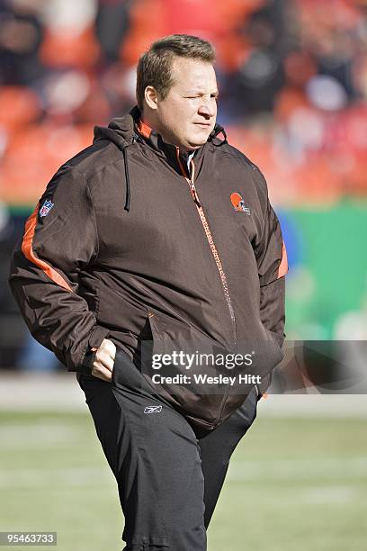 Head Coach Eric Mangini of the Cleveland Browns watches his team warm up before a game against the Kansas City Chiefs at Arrowhead Stadium on...