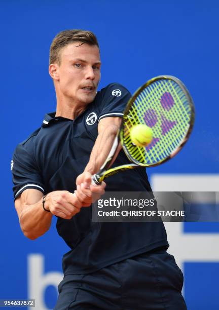 Hungary's Marton Fucsovics returns the ball to Germany's Maximilian Marterer during their quarter final match at the ATP tennis BMW Open in Munich,...