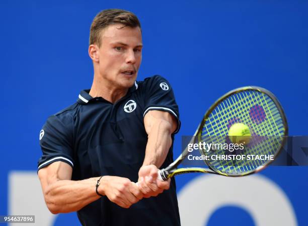 Hungary's Marton Fucsovics returns the ball to Germany's Maximilian Marterer during their quarter final match at the ATP tennis BMW Open in Munich,...