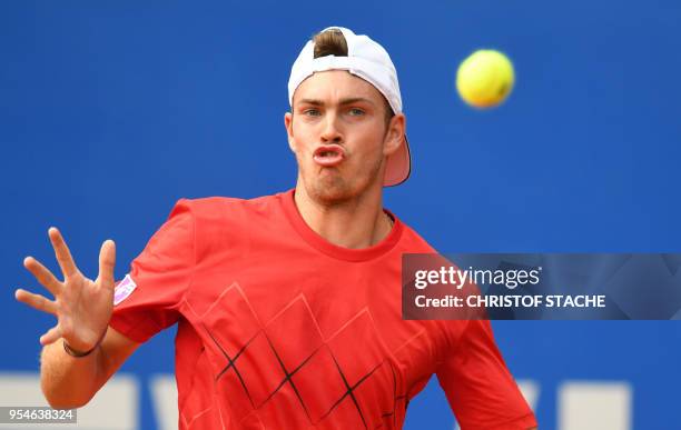 Germany's Maximilian Marterer returns the ball to Hungary's Marton Fucsovics during their quarter final match at the ATP tennis BMW Open in Munich,...