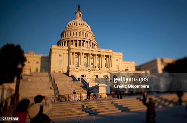 The setting sun is reflected on the west front of the Capitol building in Washington, D.C., U.S., on Monday, Oct. 20, 2009. Washington, founded in...