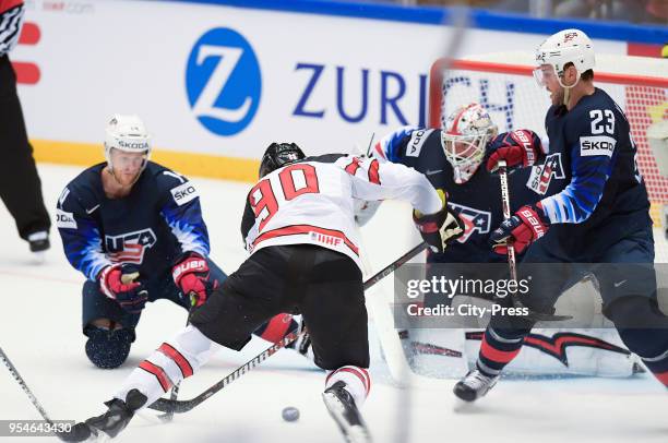 Nick Jensen of Team USA, Ryan O Reilly of Team Canada, Keith Kinkaid of Team USA and Alec Martinez of Team USA during the World Championship game...