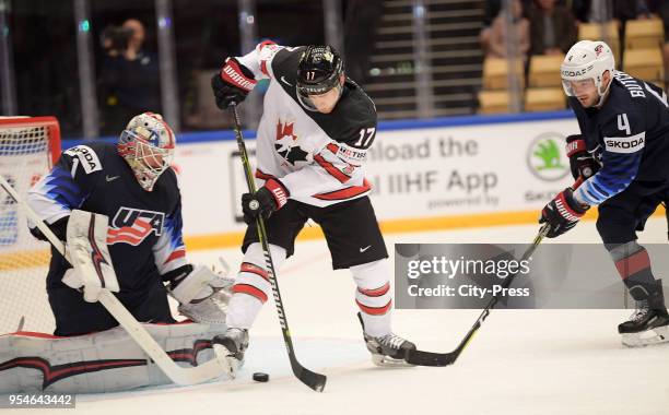 Keith Kinkaid of Team USA, Jaden Schwartz of Team Canada and Will Butcher of Team USA during the World Championship game between USA and Canada at...