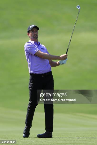 Webb Simpson plays a shot from the 18th fairway during the second round of the 2018 Wells Fargo Championship at Quail Hollow Club on May 4, 2018 in...