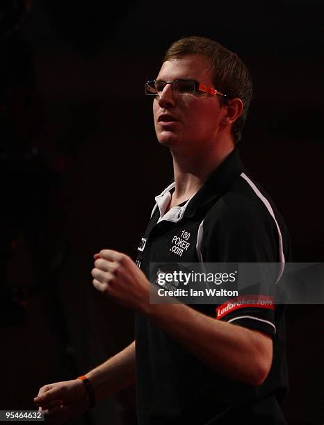 Mark Webster of Wales celebrates winning against Peter Manley of England during the 2010 Ladbrokes.com World Darts Championship Round One at...