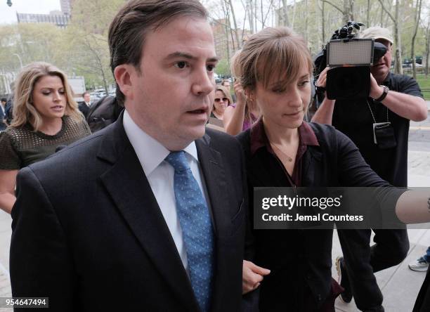 Actress Allison Mack and her legal team arrive at the United States Eastern District Court after a bail hearing in relation to the sex trafficking...