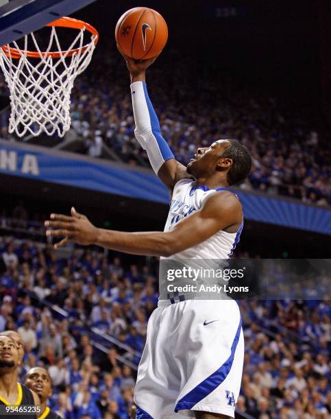 John Wall of the Kentucky Wildcats shoots the ball during the game against the Long Beach State 49ers at Rupp Arena on December 23, 2009 in...