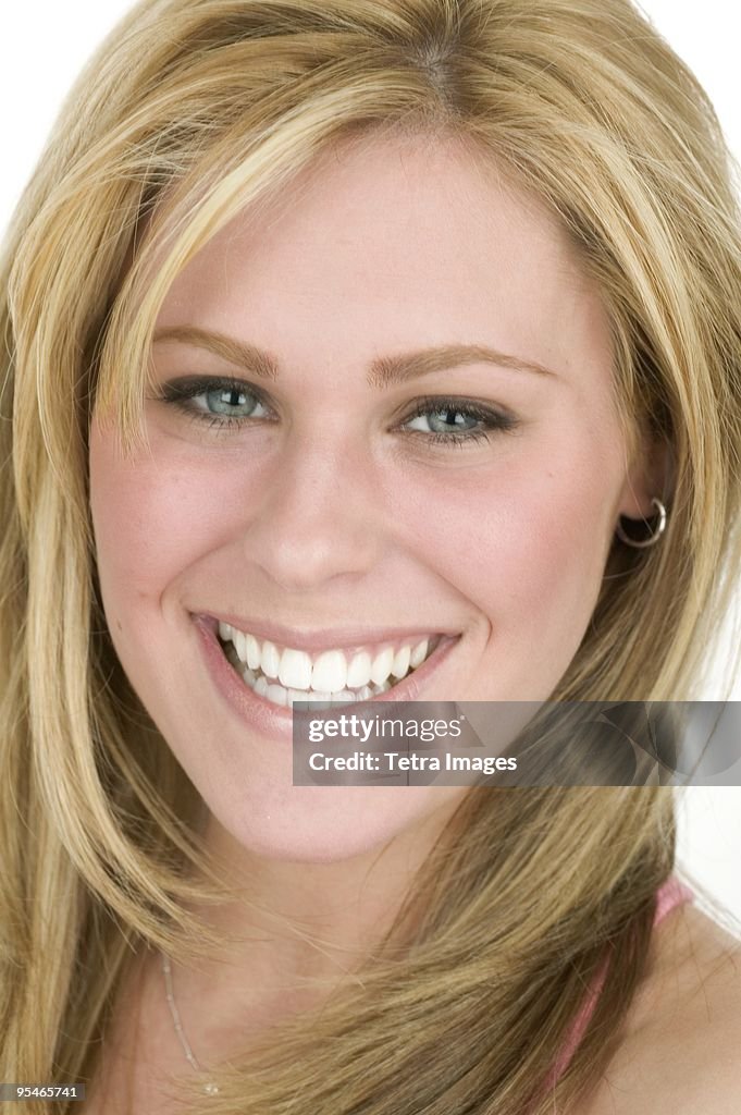 A young woman smiling