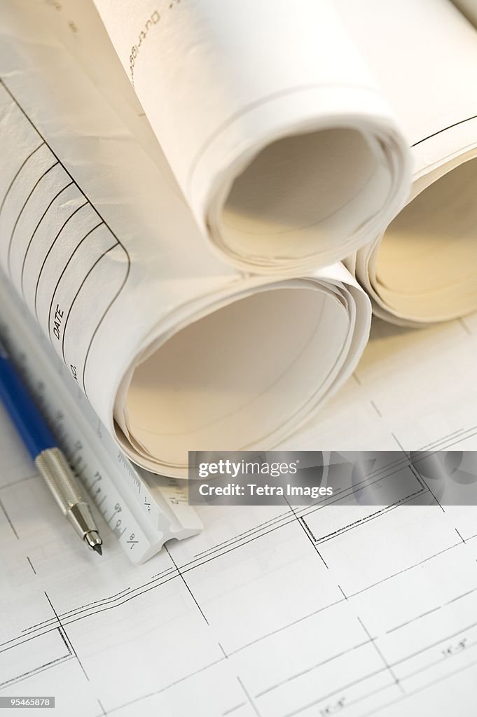 Paper Plan Shape Rular A Floor Plan With A Ruler Pencil And Rolls Of Paper On Top High-Res ...