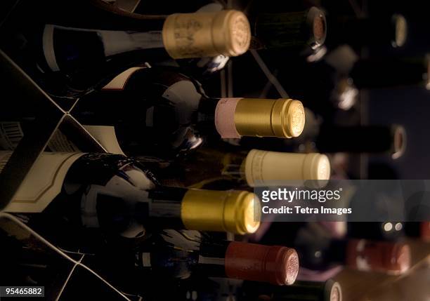 rows of wine in boxes - storage room stock-fotos und bilder