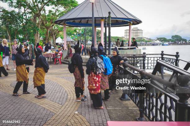local ethnic performance team in kuching - dayak stock pictures, royalty-free photos & images