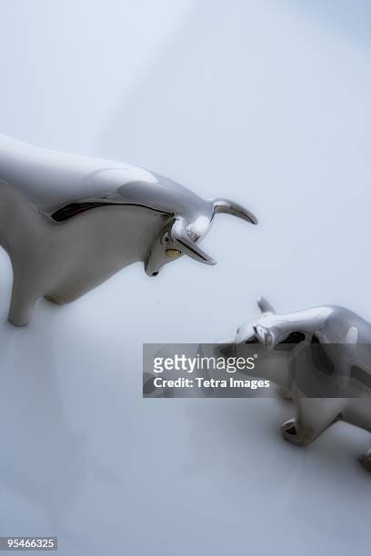 metal animal figurines - charging bull statue stock pictures, royalty-free photos & images